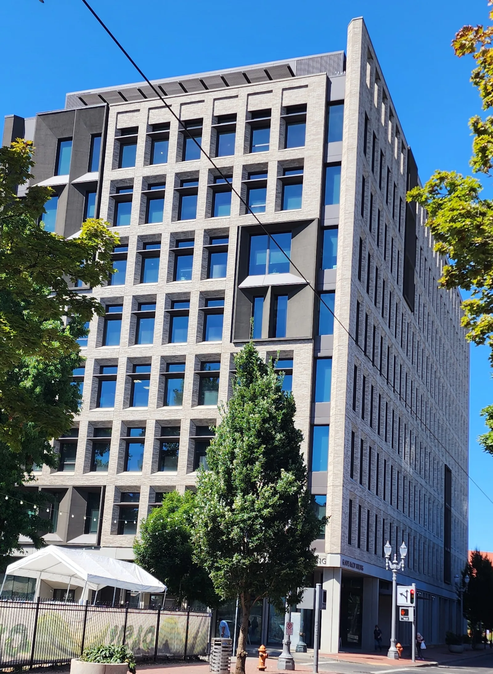 Health Department HQ rising above street trees