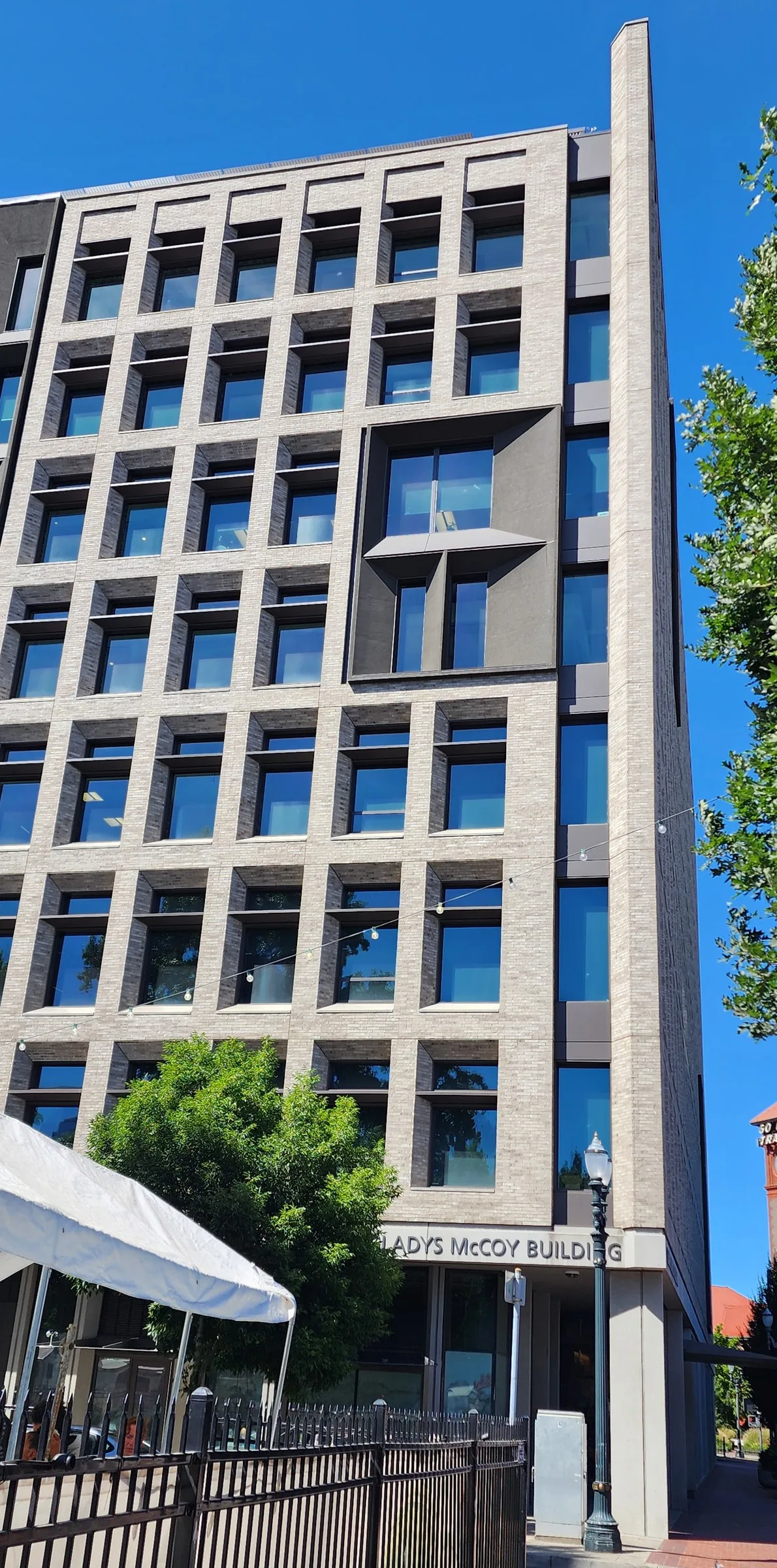 Gladys McCoy Building: brick facade with deep-set windows above its sign